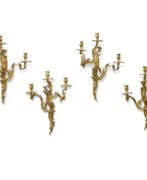 Appliques murales. A SET OF FOUR FRENCH ORMOLU THREE-BRANCH WALL LIGHTS