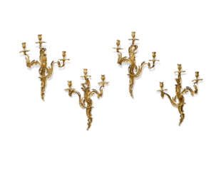 A SET OF FOUR FRENCH ORMOLU THREE-BRANCH WALL LIGHTS