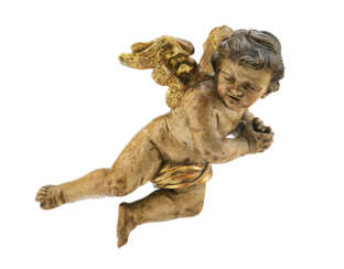 A CARVED PARCEL-GILT POLYCHROMED FIGURE OF A WINGED PUTTO
