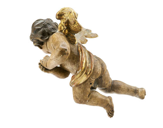 A CARVED PARCEL-GILT POLYCHROMED FIGURE OF A WINGED PUTTO - photo 5