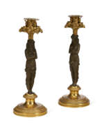 Directoire (fr. 1795-1799). A PAIR OF DIRECTOIRE ORMOLU AND PATINATED BRONZE CANDLESTICKS