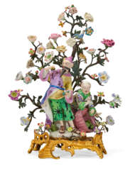 A LOUIS XV ORMOLU AND TOLE-PEINTE-MOUNTED DERBY PORCELAIN CHINOISERIE FIGURE GROUP EMBLEMATIC OF TASTE