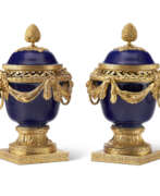 Usine de porcelaine Sèvres. A PAIR OF FRENCH ORMOLU-MOUNTED SEVRES COBALT BLUE-GROUND PORCELAIN POTPOURRI VASES AND COVERS (&#39;VASES DULAC&#39;)