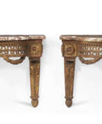 Marbre. A PAIR OF LOUIS XVI GILTWOOD HANGING CONSOLES