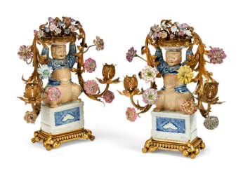 A PAIR OF LOUIS XV STYLE ORMOLU-MOUNTED CHINESE AND EUROPEAN PORCELAIN TWO-LIGHT CANDELABRA