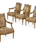 Chair. A SET OF FOUR LOUIS XVI GILT-WALNUT FAUTEILS