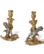 Candlestick. A PAIR OF LOUIS XV ORMOLU AND SILVERED-BRONZE CANDLESTICKS