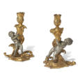 A PAIR OF LOUIS XV ORMOLU AND SILVERED-BRONZE CANDLESTICKS - Archives des enchères