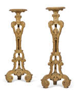 Luminaires de sol. A PAIR OF REGENCE STYLE GILTWOOD TORCHERES
