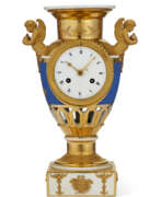 Empire. A PARIS PORCELAIN MATTE BLUE AND GOLD GROUND VASE-FORM CLOCK