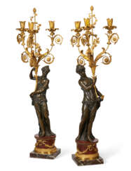 A PAIR OF LOUIS XVIII ORMOLU AND PATINATED BRONZE THREE-BRANCH CANDELABRA