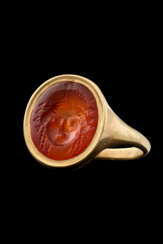 A ROMAN CARNELIAN RINGSTONE WITH A MASK OF A MAENAD