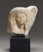 Nouvel Empire. AN EGYPTIAN LIMESTONE PORTRAIT HEAD OF A WOMAN