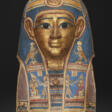AN EGYPTIAN GILT CARTONNAGE MUMMY MASK - Archives des enchères