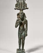 Late Period of Ancient Egypt. AN EGYPTIAN SILVER-INLAID BRONZE SOMTOUS-HARPOKRATES