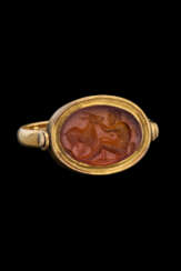 A ROMAN CARNELIAN RINGSTONE WITH A SATYR AND A GOAT