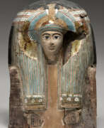 Wood. AN EGYPTIAN PAINTED WOOD COFFIN LID