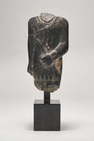 AN EGYPTIAN GRANODIORITE TORSO OF A STRIDING OFFICIAL - photo 1