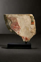 AN EGYPTIAN PAINTED LIMESTONE RELIEF FRAGMENT