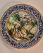 Majolica. A dish of Italian majolica Expulsion from Paradise.