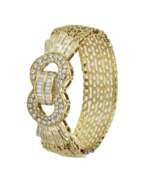 Bracelets. Gold bracelet with diamonds in the form of a belt.