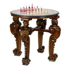 An impressive chess table with precious Roman mosaics on carved legs.