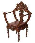 Seat furniture. Carved, richly decorated walnut chair. 19th century