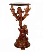 Product catalog. Wooden console with carved cupids.