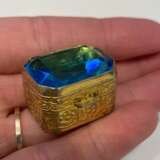Pill box of gilded metal, with a large blue stone on the lid. Early 20th century. - photo 5