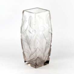 Large, heavy, crystal vase with luxurious irises.