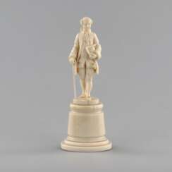 Ivory figure of a gentleman in a cocked hat.