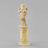 Carved ivory figurine of a boy with a bird 1800s. - photo 3