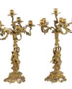 Kerzenständer. Pair of gilded bronze candelabra. 19th century