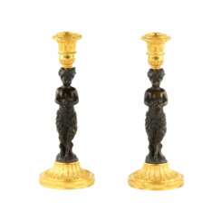 Pair of bronze, French candlesticks, in the form of fauns, mid-19th century.