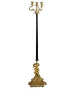 Floor lights. Bronze floor lamp with the figure of Putti. France. 19th century.