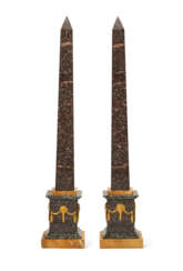 A PAIR OF FRENCH ORMOLU-MOUNTED PORPHYRY AND GRAITE OBELISKS