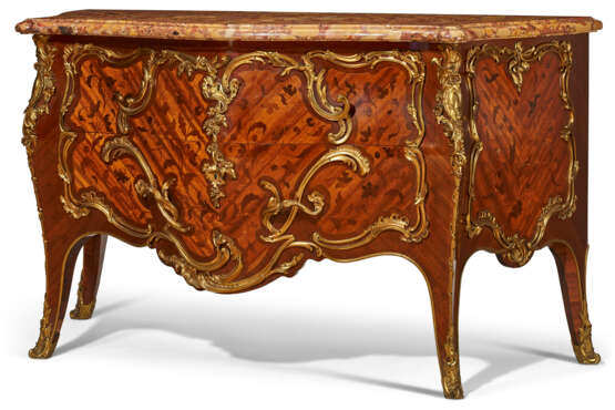 A FRENCH ORMOLU-MOUNTED BOIS SATINE, MAHAOGANY AND BOIS-DE-BOUT MARQUETRY COMMODE - photo 1