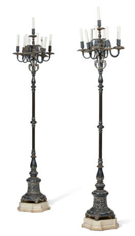 A PAIR OF RENAISSANCE-STYLE SILVERED-METAL EIGHT-LIGHT TORCHERES ON MARBLE BASES - photo 1