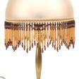 Tischlampe, 1. Hälfte 20. Jh., Messing-Fuß, halbrunder Schirm mit Behang aus Glas-Perlen und -Röhrchen, funktionstüchtig, H. 55 cm, Dm. 32 cm - Auktionsware