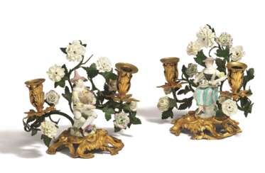 Meissen und Frankreich. BRONZE AND PORCELAIN PAIR OF TWO-LIGHT CANDLESTICKS WITH COLUMBINE AND HARLEQUIN