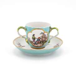 Meissen. PORCELAIN MUG WITH TURQUOISE GROUND, APPLIED FLOWERS AND RURAL SCENES