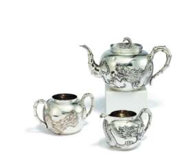 Pao Cheng. EXCEPTIONAL SILVER TEA SERVICE WITH DRAGON DECORATION