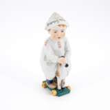 Meissen. SMALL PORCELAIN BOY WITH NEWSPAPER HAT ON A LITTLE WOODEN HORSE - фото 1
