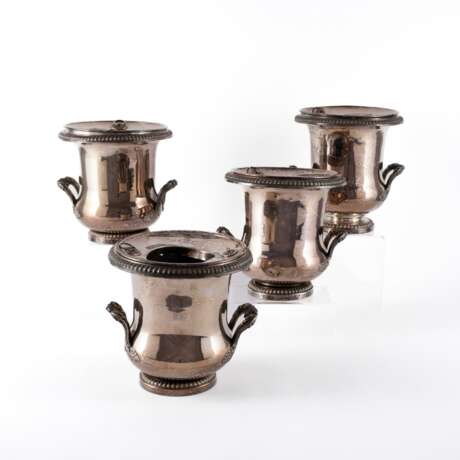 METAL SUITE OF FOUR WINE COOLERS WITH GADROON DECOR - photo 1