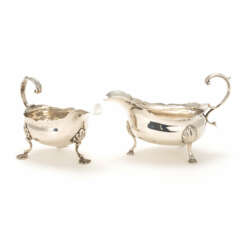 A pair of George II and III silver creamers