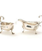 Silverware. A pair of George II and III silver creamers