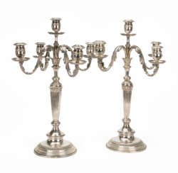 A pair of silver girandoles in the classicist style