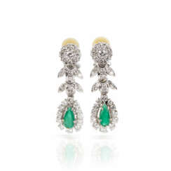 Pair of clip earrings set with emerald diamonds
