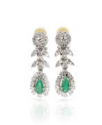 Overview. Pair of clip earrings set with emerald diamonds