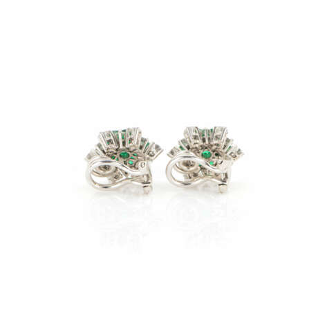 Pair of clip earrings set with emeralds and diamonds - фото 2